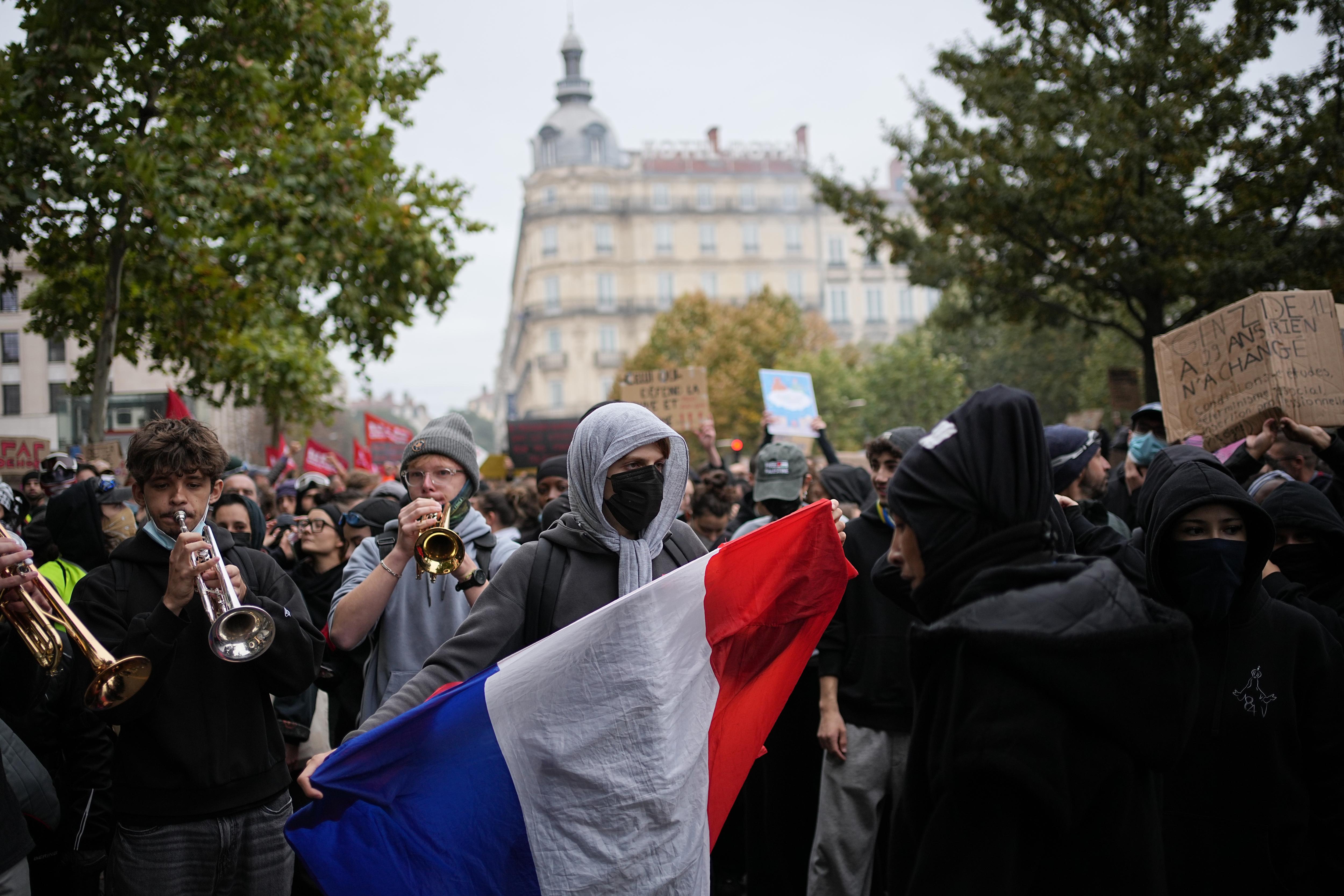 Buildings burn and tear gas thrown during French education and cost of living rallies