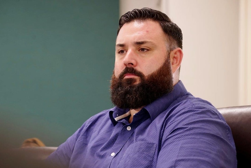 Mark Turner, the MLA for the Palmerston seat of Blain, sits in NT Parliament looking concerned.