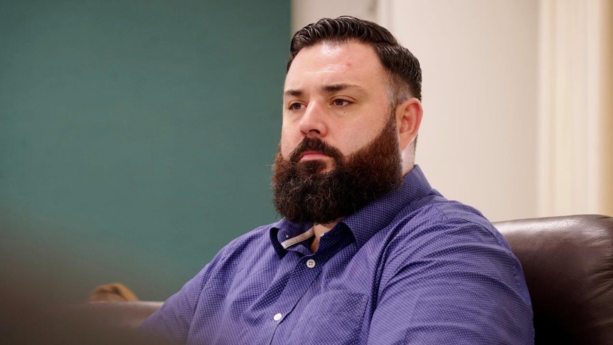 Mark Turner, the MLA for the Palmerston seat of Blain, sits in NT Parliament looking concerned.