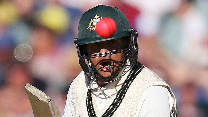 Usman Khawaja stares at the spinning pink orb after playing a cut shot