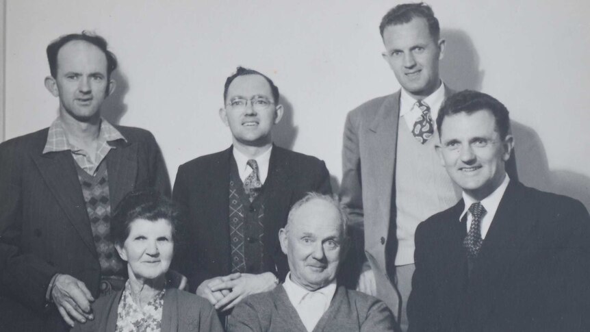 A family portrait of the McKay family, showing the two parents surrounded by their adult sons.