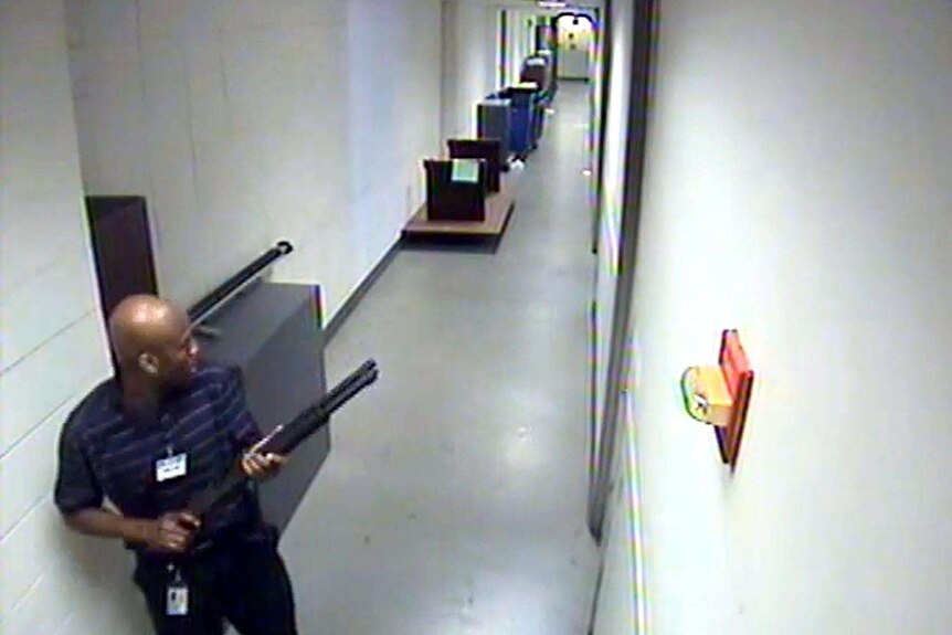 Washington Navy Yard shooter Aaron Alexis moves through a hallway.