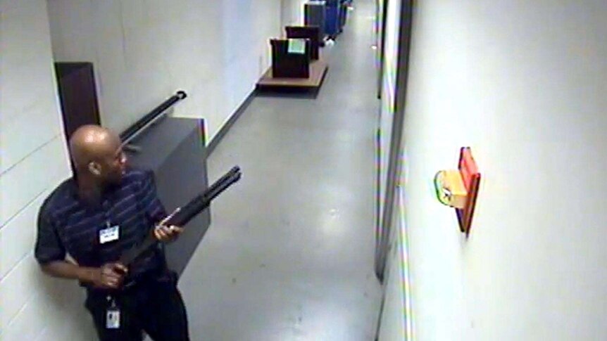 Washington Navy Yard shooter Aaron Alexis moves through a hallway.