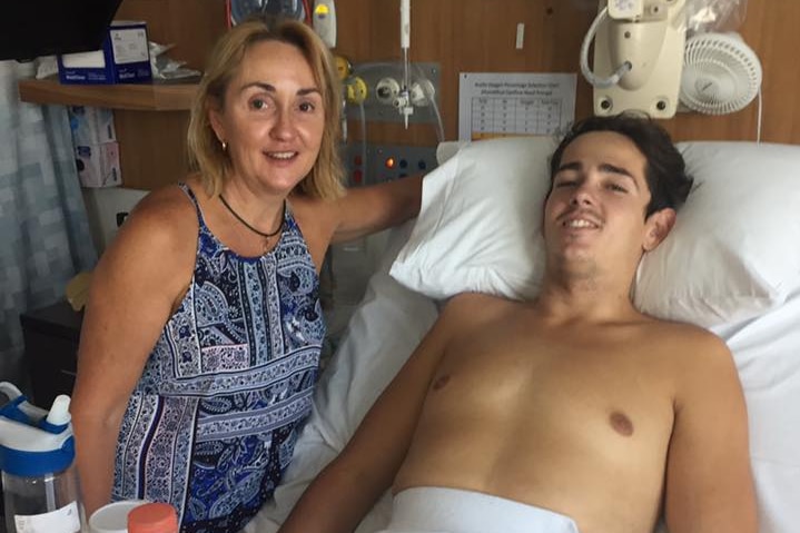 Nick Dempsey on hospital bed with his mum Trudy
