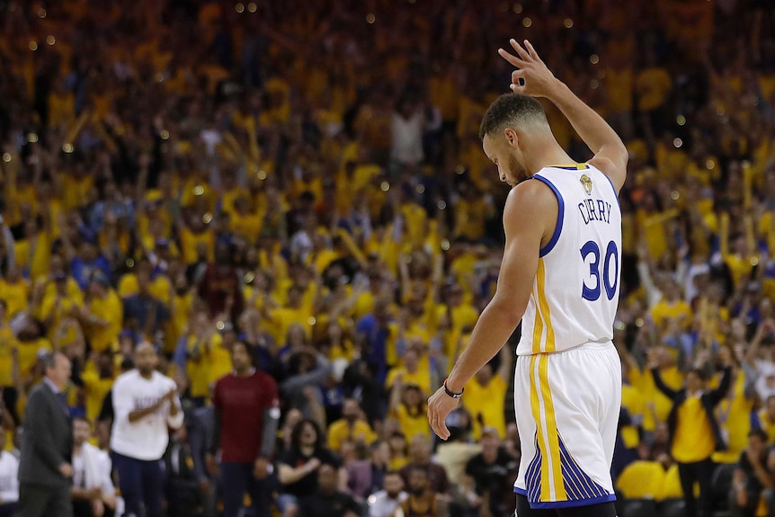 Star Warriors guard Stephen Curry acknowledges the crowd during the win over the Cavaliers.