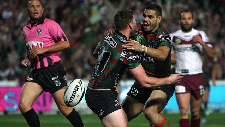 Rabbitohs players celebrate a try against Manly in Gosford in round 23.