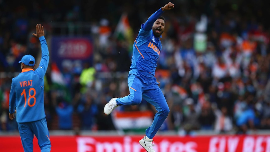 A bowler leaps in the air in joy after taking a wicket at the Cricket World Cup.