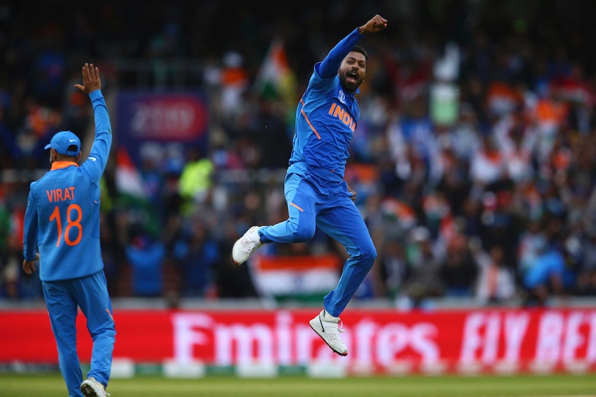 A bowler leaps in the air in joy after taking a wicket at the Cricket World Cup.
