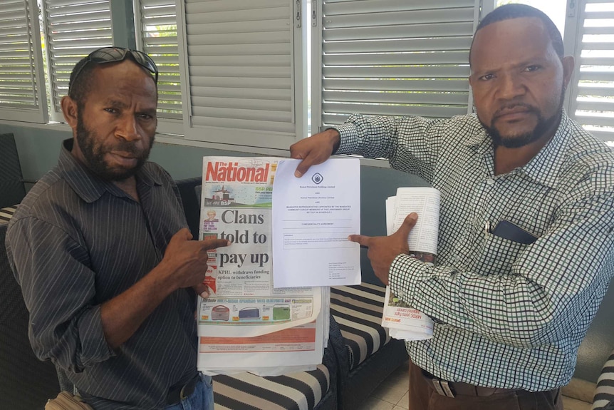Landowners hold newspaper showing finance offer withdrawn