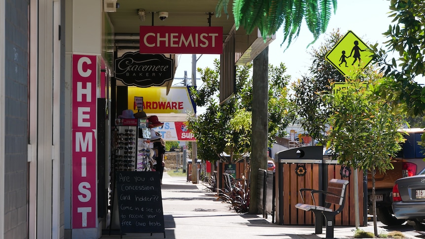 A chemist, bakery and hardware store in a small town's main street