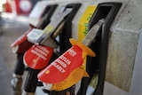 A close up of petrol pumps at a service station.