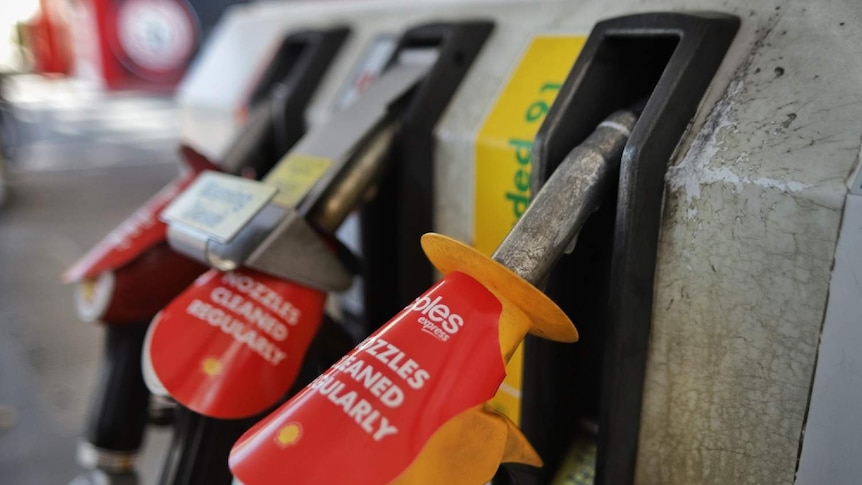 A close up of petrol pumps at a service station.