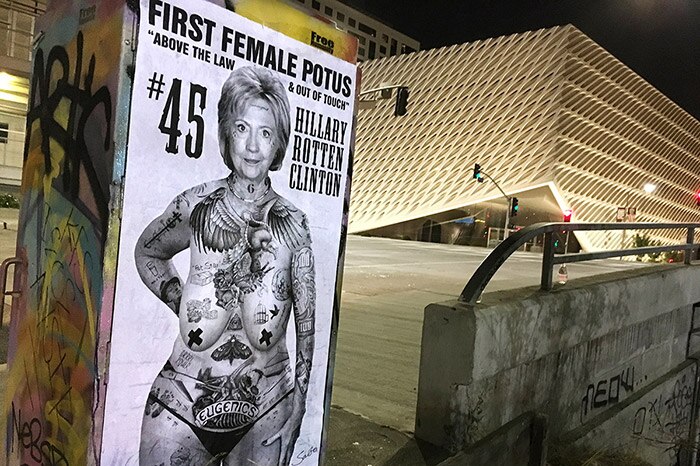 Black and white anti-Hillary Clinton poster showing her nude and covered in tattoos.