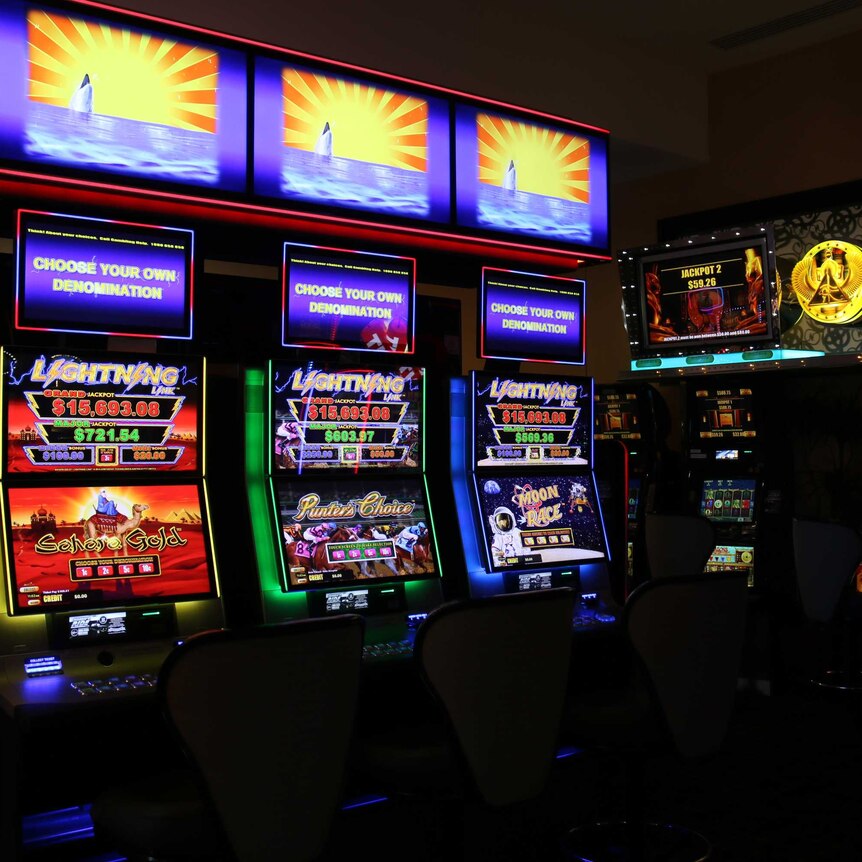 Several poker machines inside a club.
