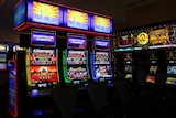 Several poker machines inside a club.
