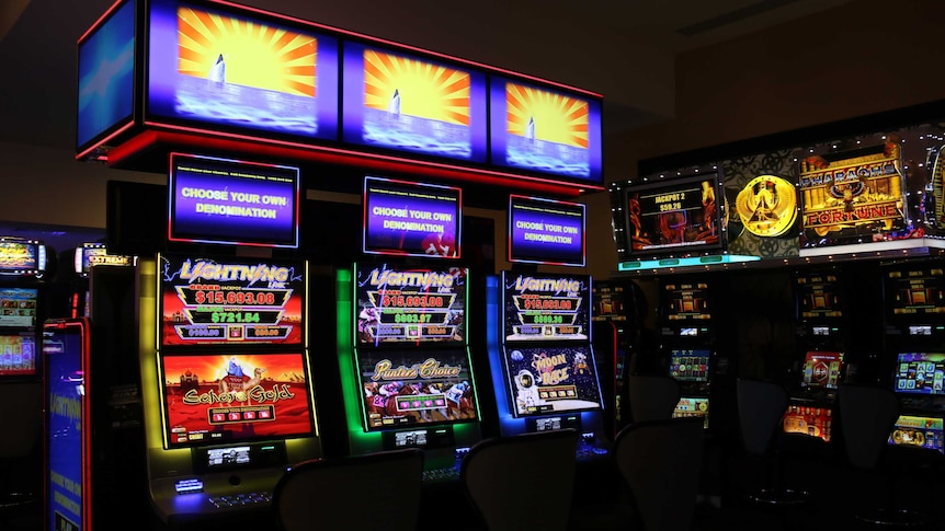 Several poker machines inside a club.