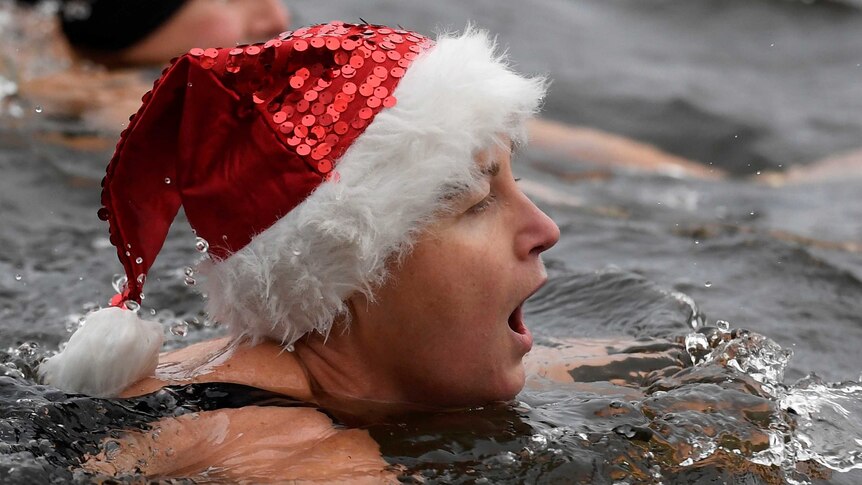 Swimmer reacts during Christmas Day race in Hyde Park