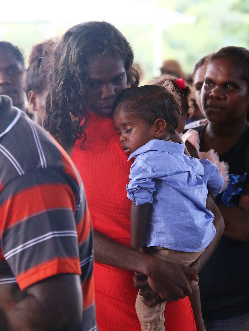 Student Victoria Lansen with her one-year-old son Victor, at her Year 12 graduation ceremony.