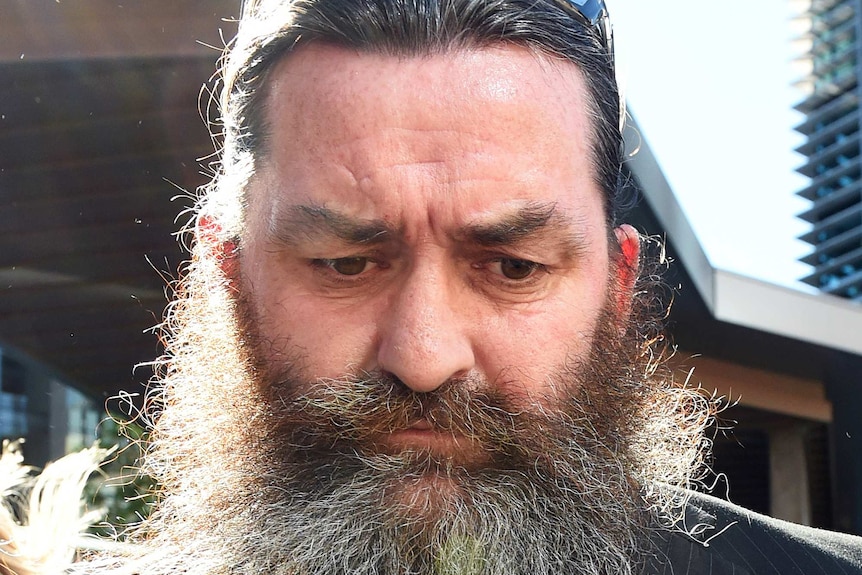 Christopher Arthur Neville Kent walks from the Magistrates Court in Brisbane, Wednesday, May 6, 2015.