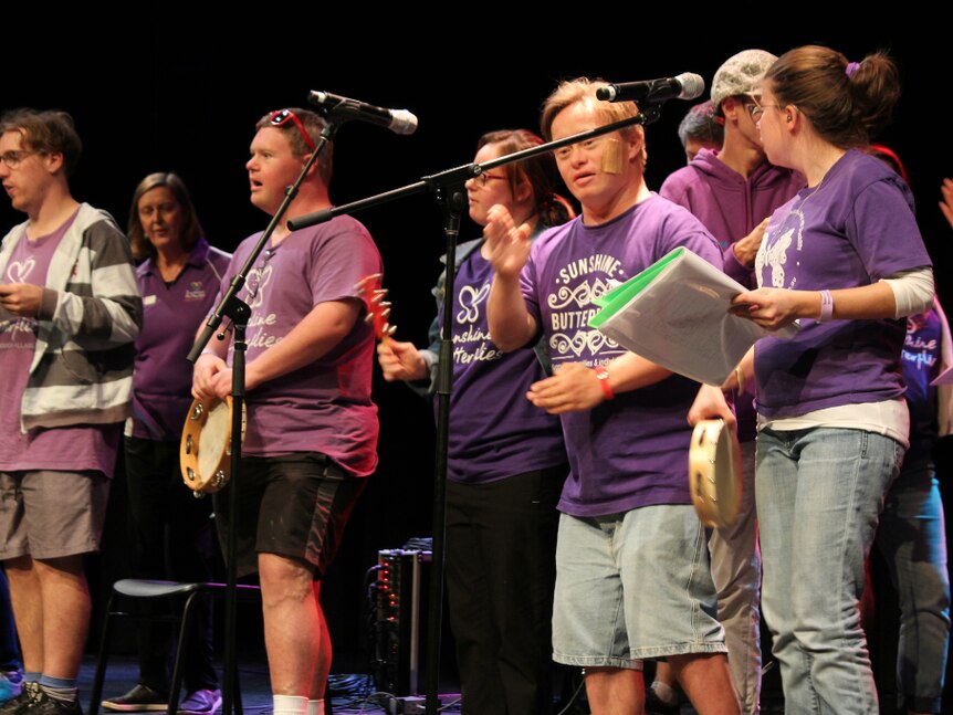 Group of people with disabilities performing on stage