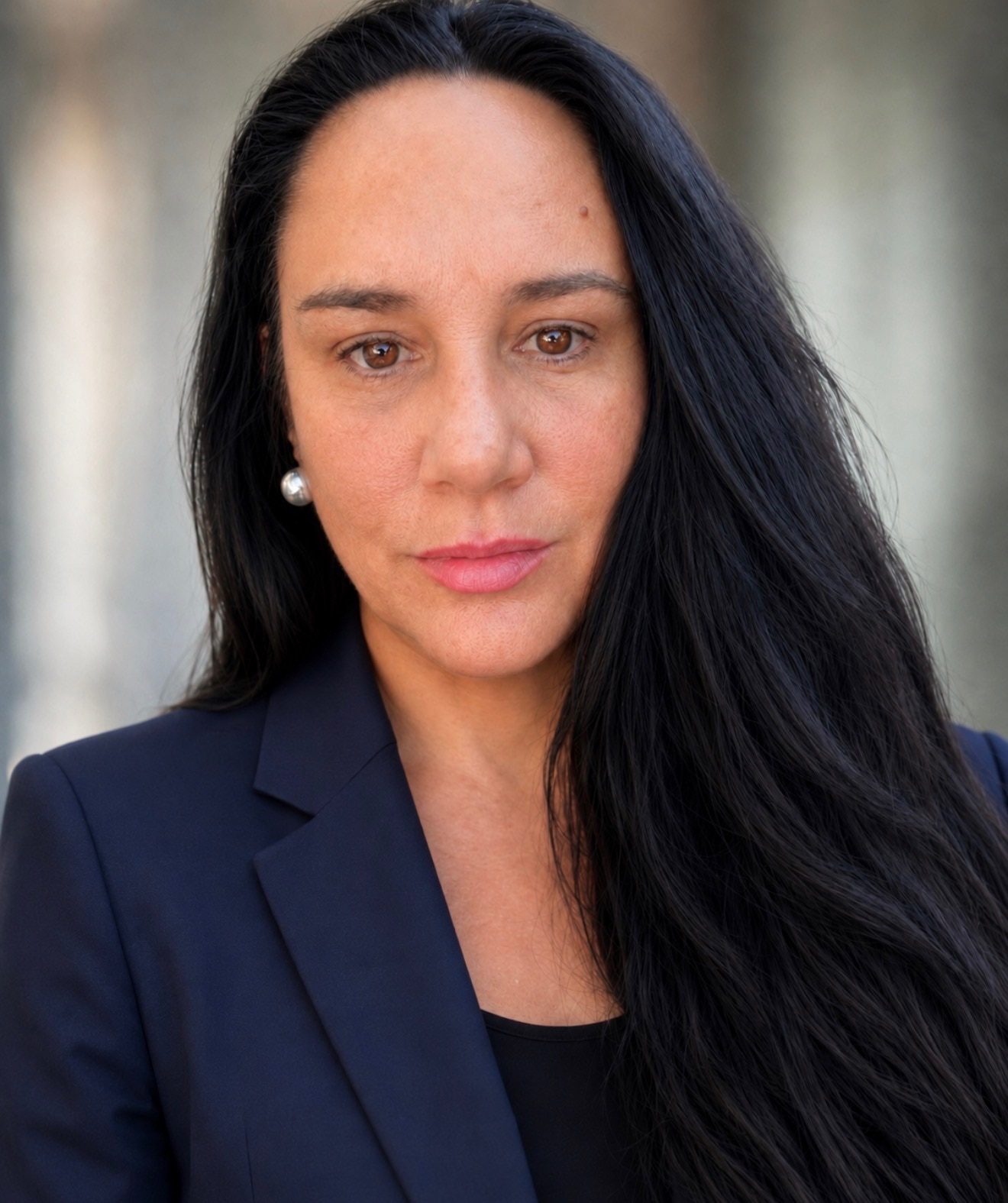 Close-up of a woman with long dark hair. 