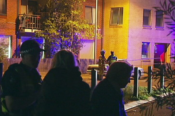 Police interview residents evacuated following a fire in a Port Melbourne housing block