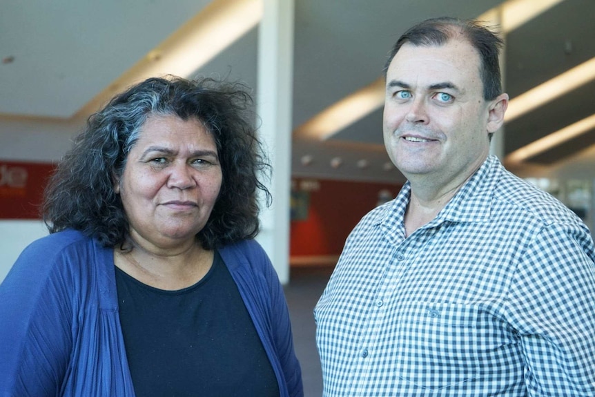 Naomi Smith and David Stevenson stand next to each other and face the camera.