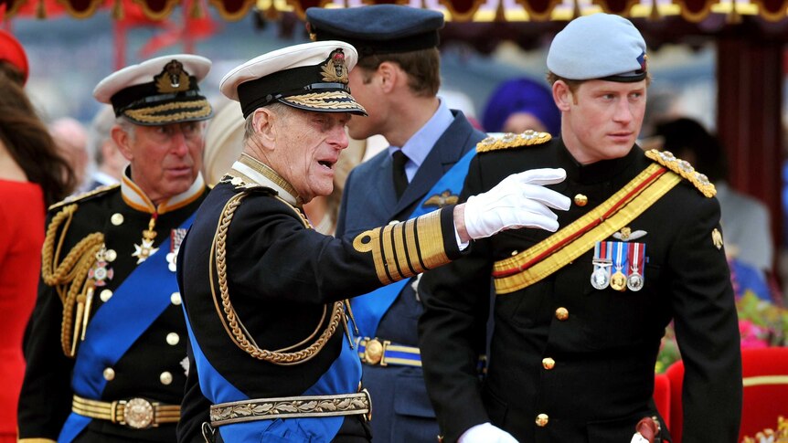 Prince Philip (C) talks to Prince Charles (L), Prince William (2nd R) and Prince Harry during a Diamond Jubilee event.