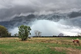 Storm clouds building over a rural property