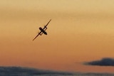 Hijacked Seattle plane is seen streaking across the golden sky.