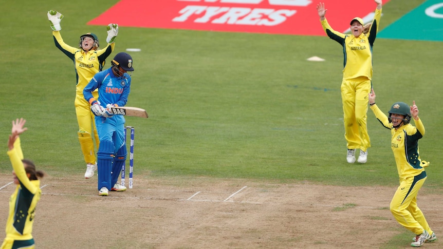 Australia's Alyssa Healy celebrates her catch to dismiss India's Smriti Mandhana at the Women's World Cup.