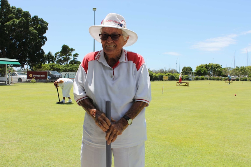 92 year old Southport croquet club member Beryl Phillips on the course holding her mallet