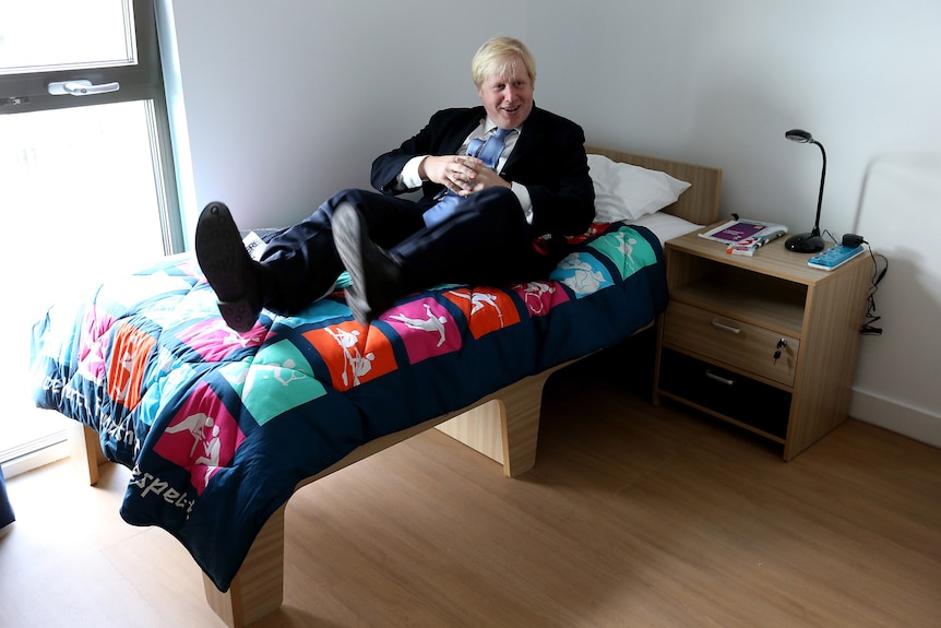 Boris Johnson relaxes at the Olympic village