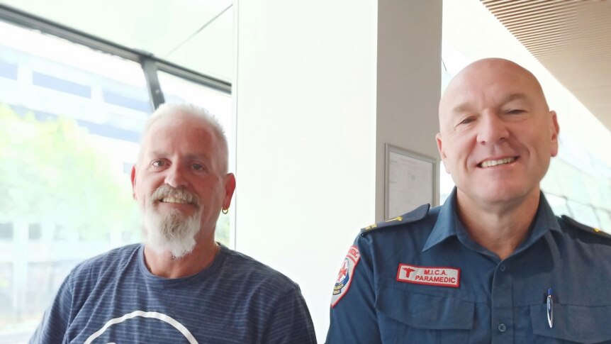 Paramedic Tim Jobling standing next to Mick Stephenson from Ambulance Victoria.