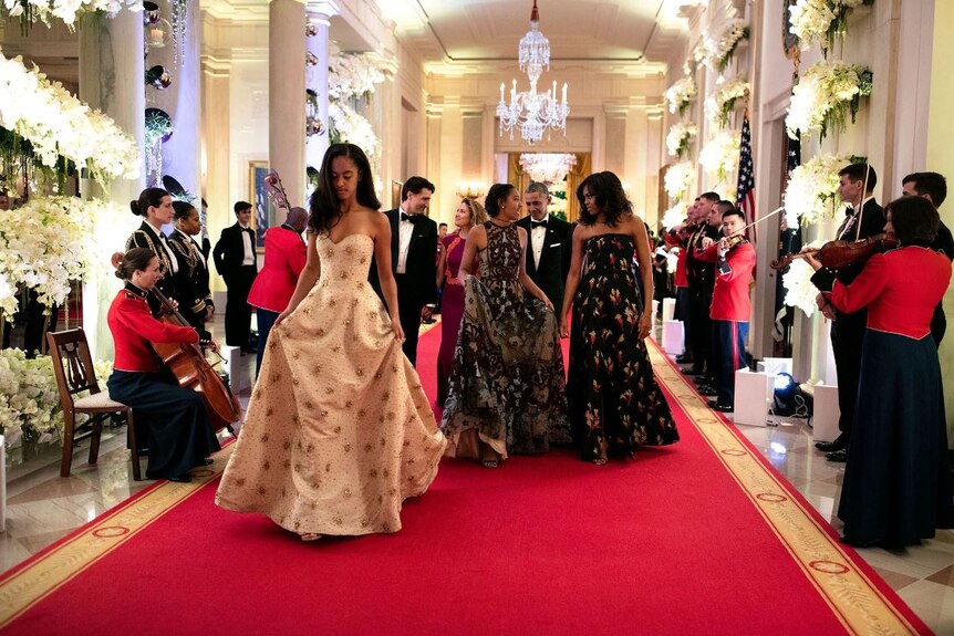 Malia, foreground, and Sasha were both invited guests for the State Dinner