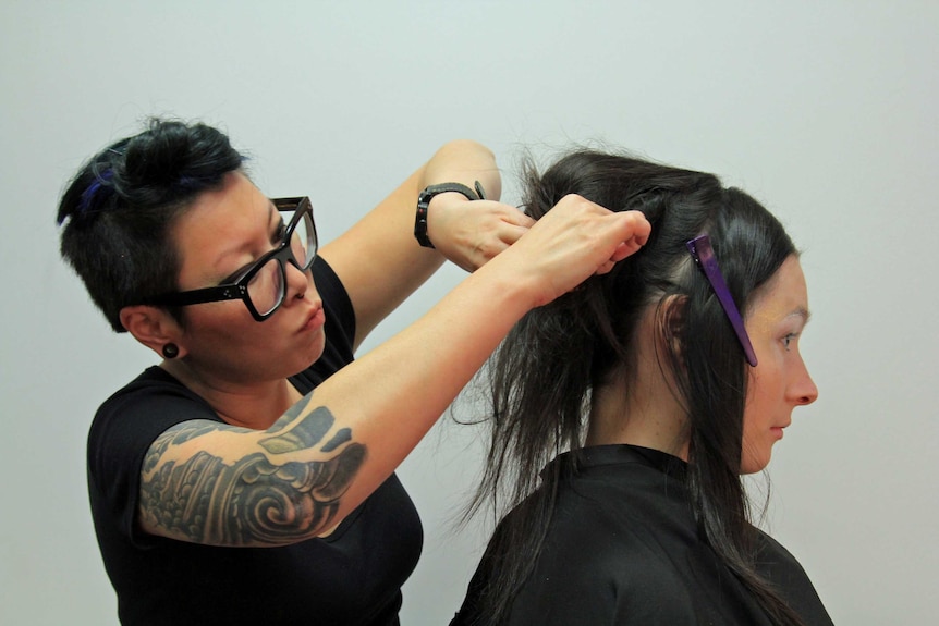 Gia Sung doing hair