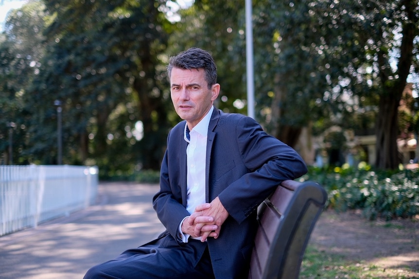 a man sitting on a bench 