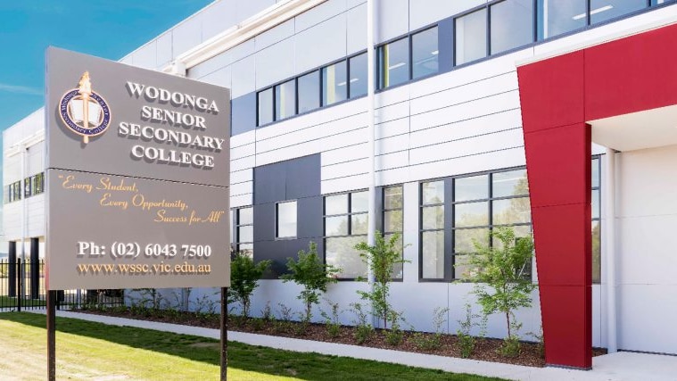 The exterior of a school building with a sign reading Wodonga Senior Secondary College.