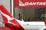 Qantas jet taxis through Sydney Airport.