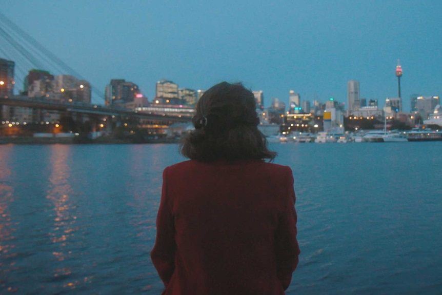 Woman looks over the harbour