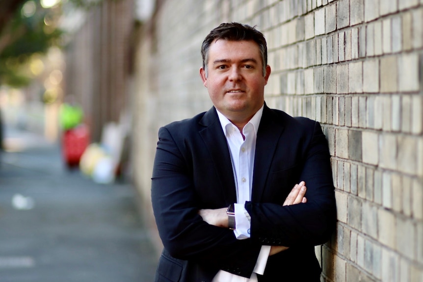 a man in a suit outside in Sydney