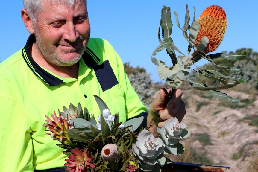 Farmer with bunch of Australian native flowers