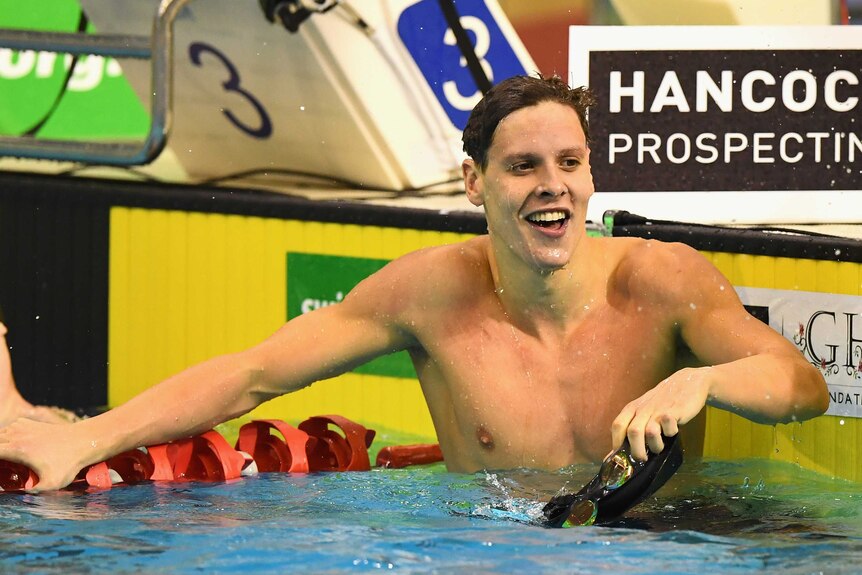 Mitch Larkin celebrates winning the men's 200m backstroke final at the Australian swim titles.