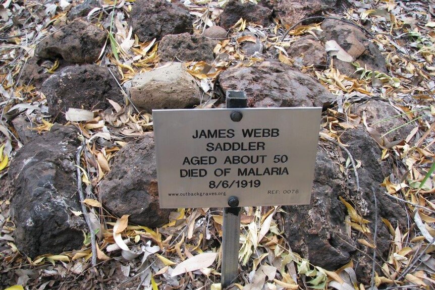 A photo showing the plaque that marks the grave of a 50-year-old man who died of malaria.