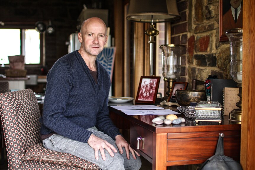 Michael Smith at home in Chewton at his desk with his draft legislation Bills.