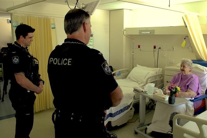 Constable Gillet (L) and Constable Engles visit Ms Freingruber in hospital.