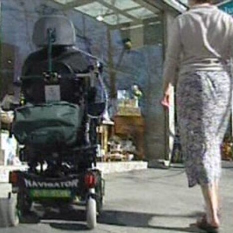 disability generic electric wheelchair and carer thumbnail