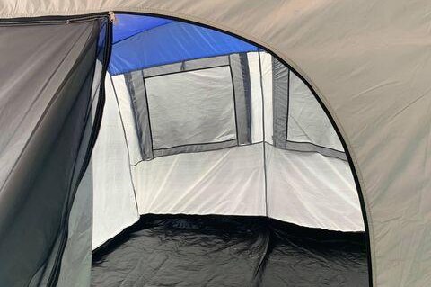 A set up tent is empty inside.