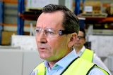 A close up photo of WA Premier Mark McGowan wearing safety glasses.