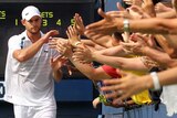 Andy Roddick celebrates with fans at US Open